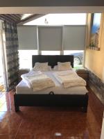 Posteľ alebo postele v izbe v ubytovaní Regina Delux Apartman