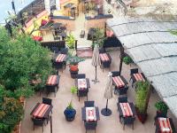 an overhead view of a patio with tables and chairs at Le Relais Des Dentelles in Beaumes-de-Venise