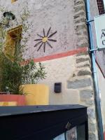 a clock on the side of a building at Le Relais Des Dentelles in Beaumes-de-Venise