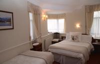 Postel nebo postele na pokoji v ubytování Windermere Lynwood Guest House