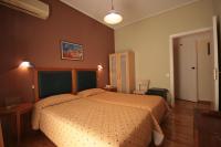 Posteľ alebo postele v izbe v ubytovaní Adams Hotel
