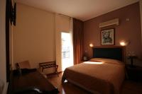 Posteľ alebo postele v izbe v ubytovaní Adams Hotel