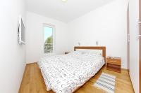 Łóżko lub łóżka w pokoju w obiekcie Apartments Vila Moli
