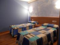Postel nebo postele na pokoji v ubytování Hotel Doña Maria
