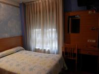 Postel nebo postele na pokoji v ubytování Hotel Doña Maria