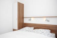 Łóżko lub łóżka w pokoju w obiekcie Apartments Vila Moli