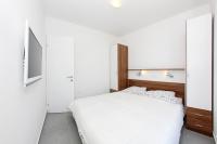 Łóżko lub łóżka w pokoju w obiekcie Apartments Vila Moli