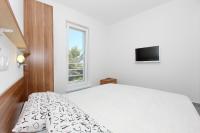Łóżko lub łóżka w pokoju w obiekcie Apartments Vila Moli