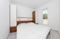 Łóżko lub łóżka w pokoju w obiekcie Apartments Vila Moli