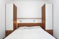 Łóżko lub łóżka w pokoju w obiekcie Apartments Vila Moli