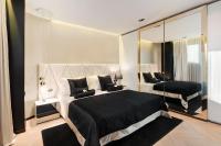 Posteľ alebo postele v izbe v ubytovaní Posh Residence Luxury Suites