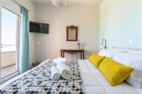 A bed or beds in a room at Kyma seaview Apartments, Episkopi beach Rethymno