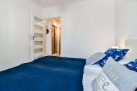 Łóżko lub łóżka w pokoju w obiekcie LTC Apartments Malczewskiego Centrum