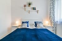 Łóżko lub łóżka w pokoju w obiekcie LTC Apartments Malczewskiego Centrum
