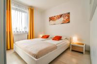 Łóżko lub łóżka w pokoju w obiekcie LTC Apartments Malczewskiego Centrum