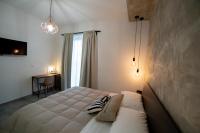 A bed or beds in a room at Anna & Alfredo bed and breakfast
