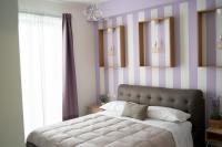A bed or beds in a room at Anna & Alfredo bed and breakfast