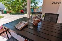 Patio alebo iná vonkajšia časť ubytovania Laurea & Casia