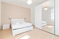 Posteľ alebo postele v izbe v ubytovaní Prato della Valle Roomy Flat