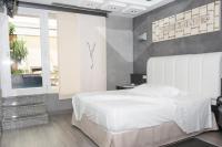 Cama o camas de una habitación en Zouk Hotel