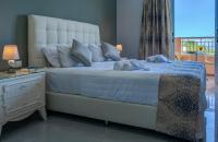 Llit o llits en una habitaci&oacute; de Zante Pantheon Hotel