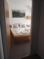 Postel nebo postele na pokoji v ubytování Hotel Jestřábí