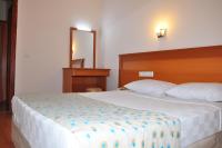 Postel nebo postele na pokoji v ubytování Cinar Family Suite Hotel Side
