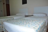 Postel nebo postele na pokoji v ubytování Cinar Family Suite Hotel Side