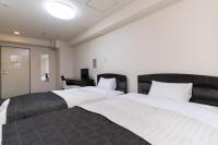 HOTEL CITY INN WAKAYAMA 和歌山駅前にあるベッド