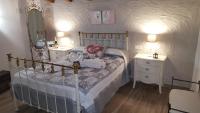 Postel nebo postele na pokoji v ubytování Casas Rurales Almoguer