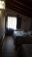 Postel nebo postele na pokoji v ubytování Casas Rurales Almoguer