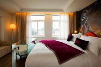 a hotel room with a large bed and a window at Hotel de l'Opera Hanoi - MGallery in Hanoi