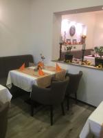 A seating area at Pension & Restaurant La Amalia