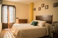 A bed or beds in a room at Posada Marina