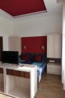 Televízia a/alebo spoločenská miestnosť v ubytovaní Frank & Fang Apartments MK7