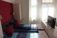 Televízia a/alebo spoločenská miestnosť v ubytovaní Frank & Fang Apartments MK7