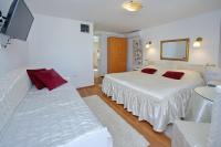 Postel nebo postele na pokoji v ubytování Apartments Brankica