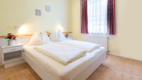 A bed or beds in a room at Ferienhaus Stefanie