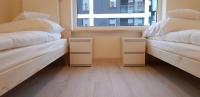 Posteľ alebo postele v izbe v ubytovaní Apartament Kraków Arena