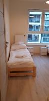 Posteľ alebo postele v izbe v ubytovaní Apartament Kraków Arena