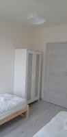 Posteľ alebo postele v izbe v ubytovaní Apartament Kraków Arena