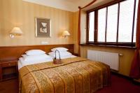 Łóżko lub łóżka w pokoju w obiekcie Hotel Willa Lubicz