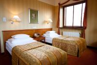 Łóżko lub łóżka w pokoju w obiekcie Hotel Willa Lubicz