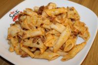 a pile of pasta on a plate on a table at Yeşilyurt Residence in İzmir