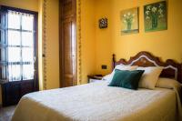 A bed or beds in a room at Posada Marina