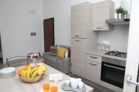A kitchen or kitchenette at Rosy House - Hospitality