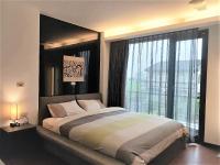 a bedroom with a large bed with a large window at The Designer&#39;s House in Wujie