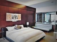 a bedroom with a large white bed and a window at The Designer&#39;s House in Wujie