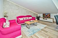 Televízia a/alebo spoločenská miestnosť v ubytovaní Apartments Bubalo