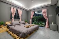 Postel nebo postele na pokoji v ubytování Hua Hin Lae I Aoon